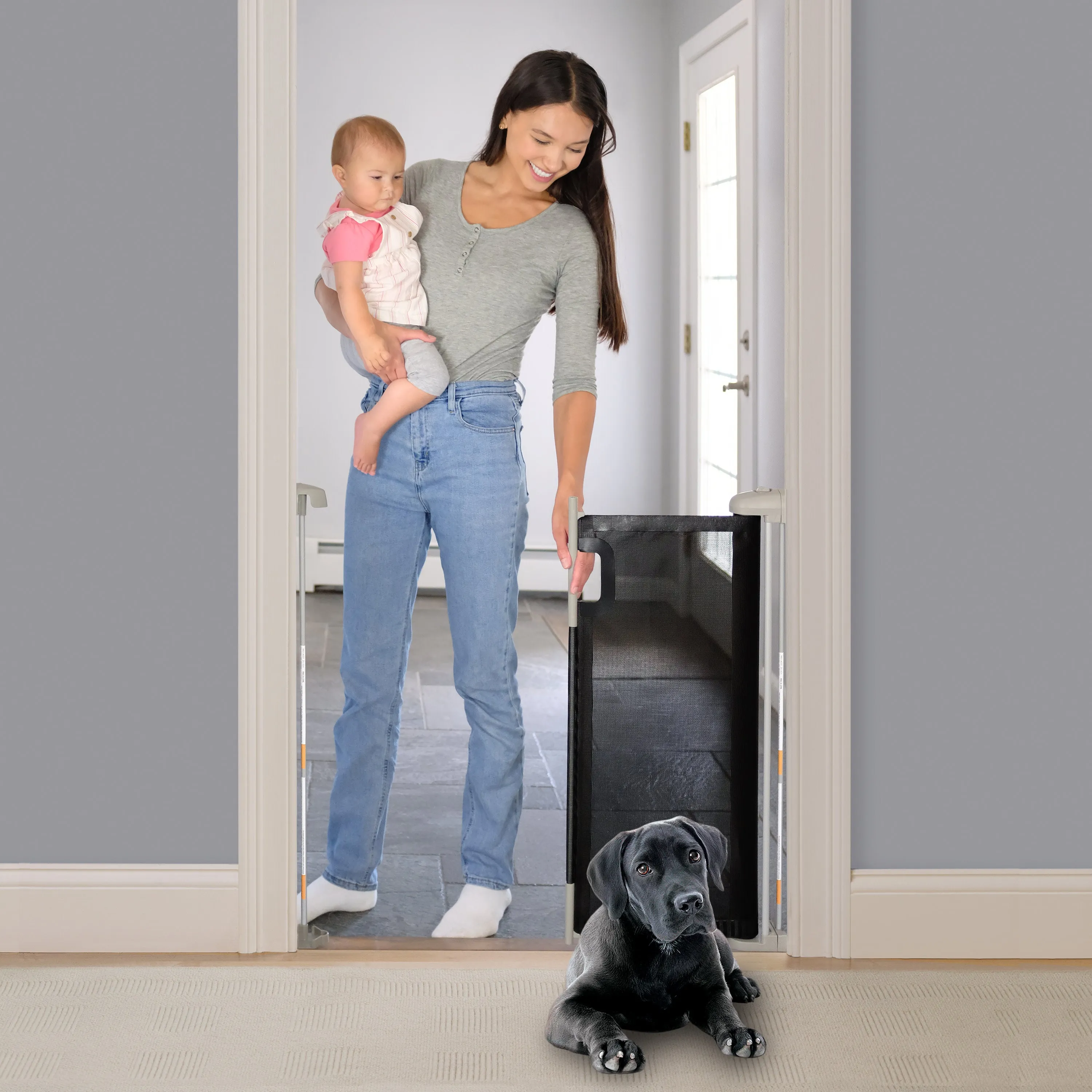 The Thruway 52W Series Pet and Baby Retractable Gate with Tuck Away Mesh, Openings up to 52" Wide - Black
