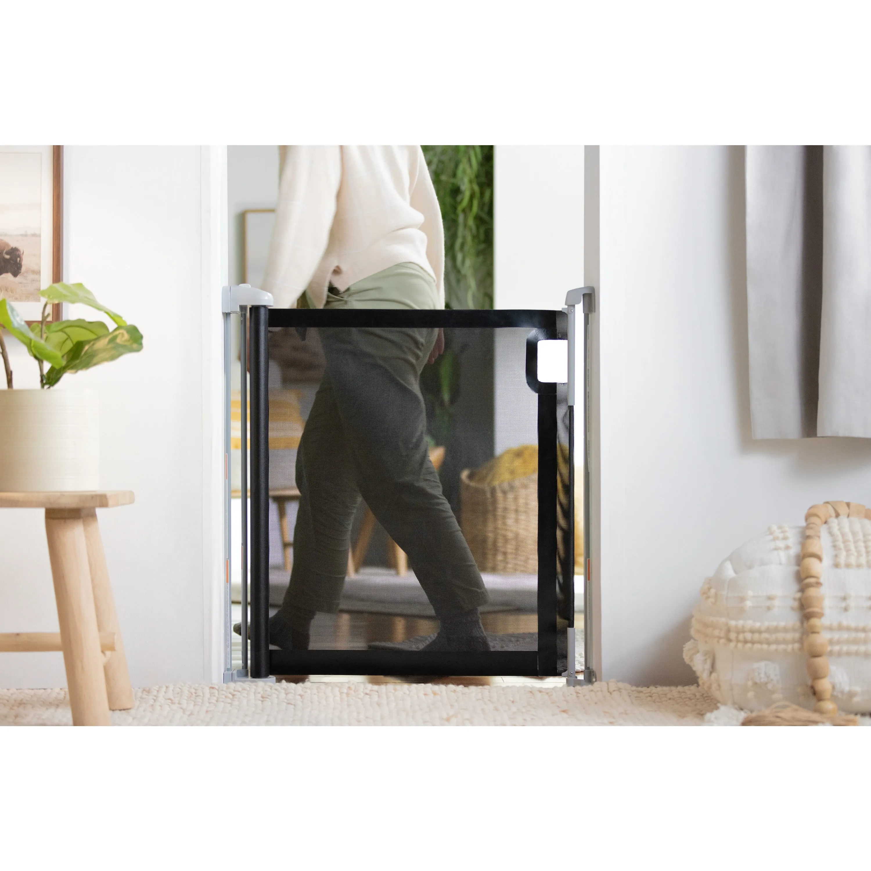 The Thruway 52W Series Pet and Baby Retractable Gate with Tuck Away Mesh, Openings up to 52" Wide - Black
