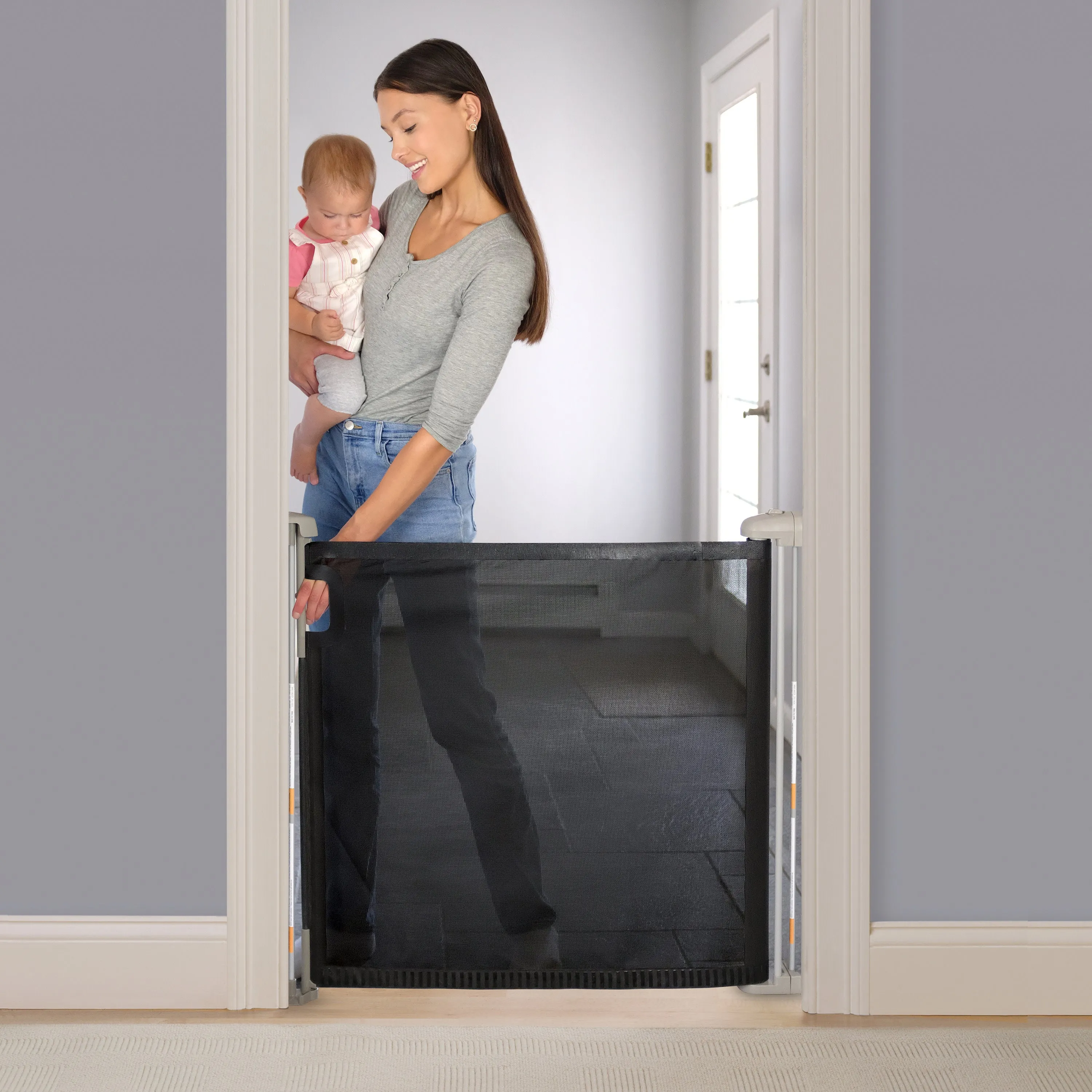 The Thruway 52W Series Pet and Baby Retractable Gate with Tuck Away Mesh, Openings up to 52" Wide - Black