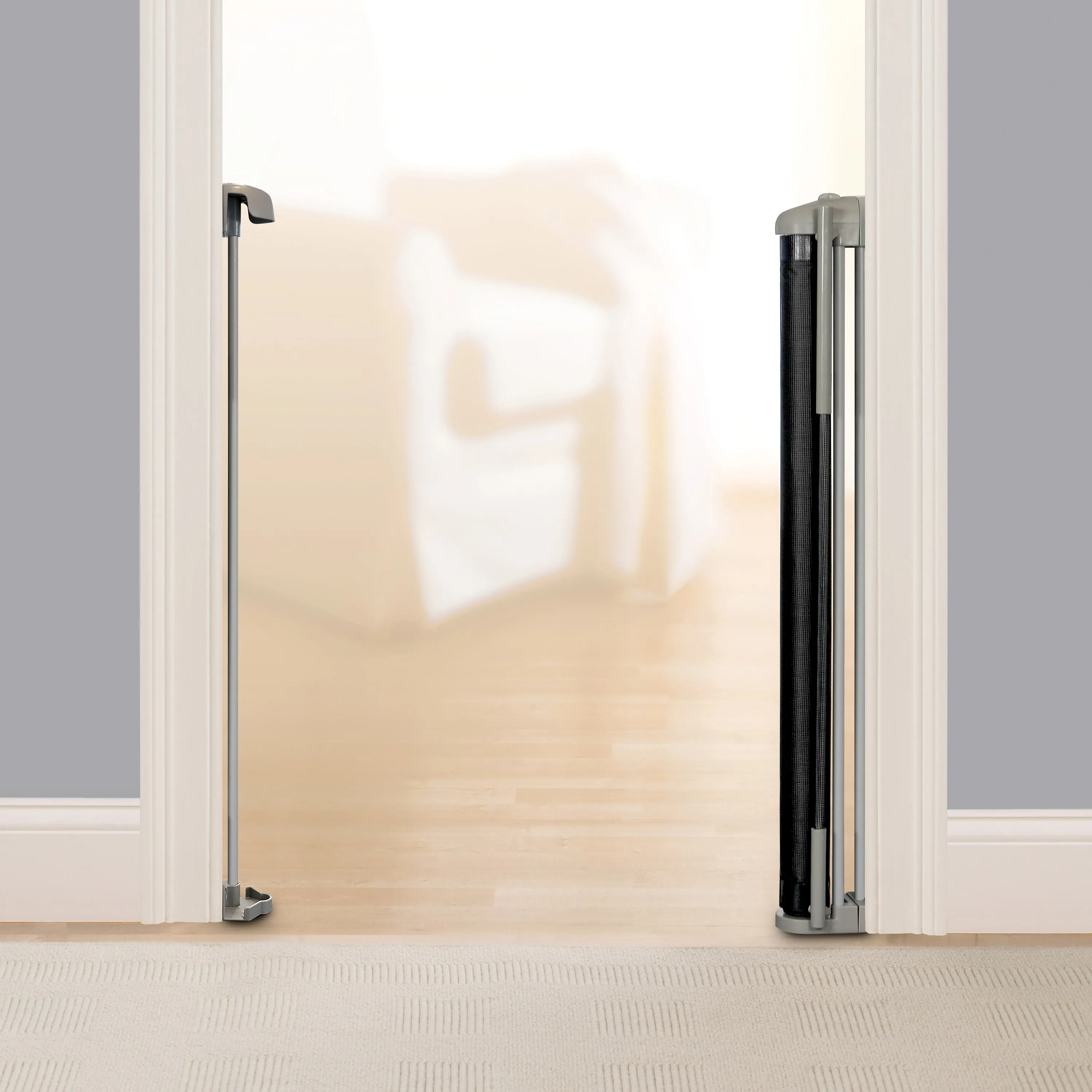 The Thruway 52W Series Pet and Baby Retractable Gate with Tuck Away Mesh, Openings up to 52" Wide - Black