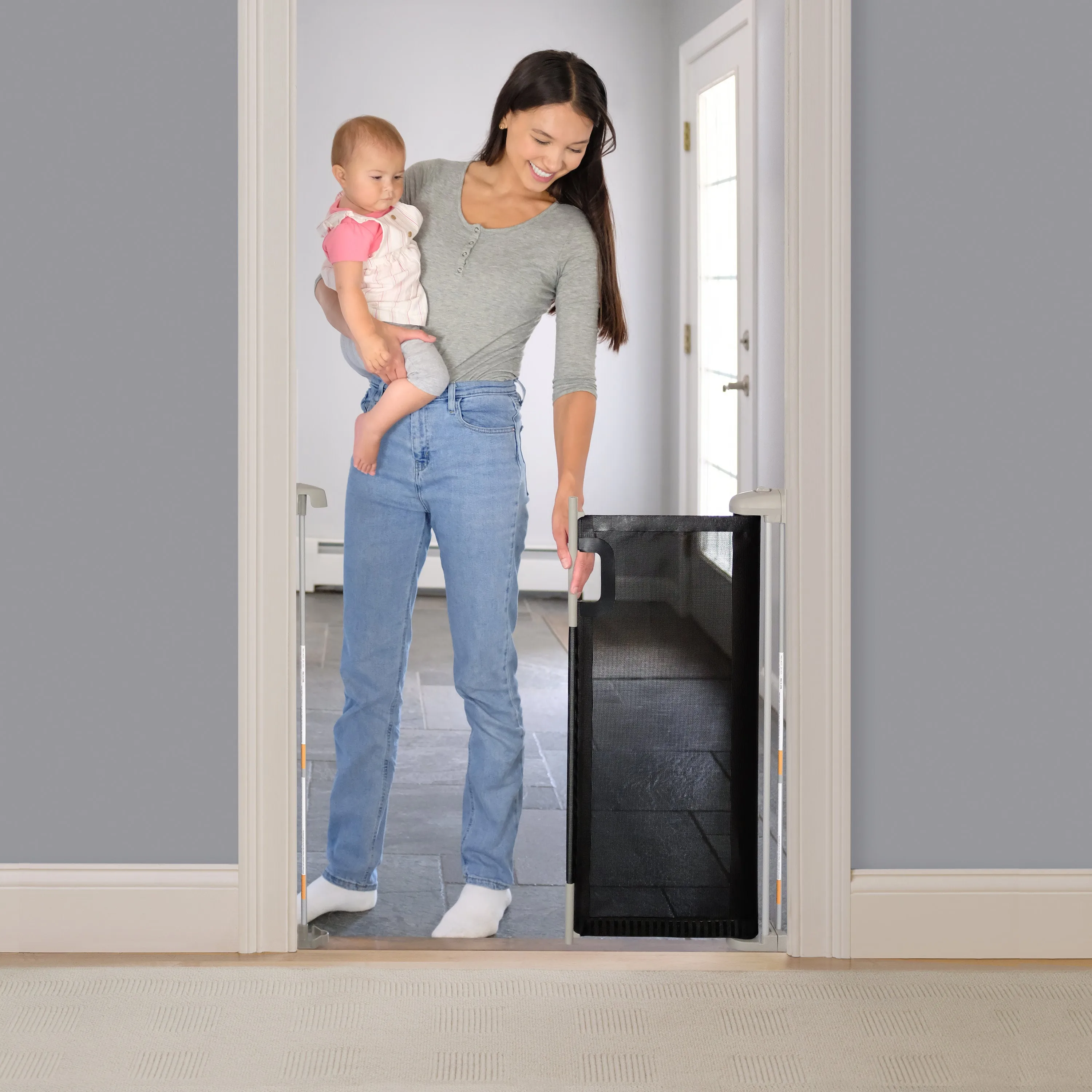 The Thruway 52W Series Pet and Baby Retractable Gate with Tuck Away Mesh, Openings up to 52" Wide - Black